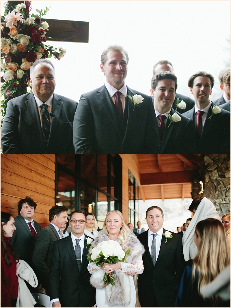 Groom watching bride walk down aisle